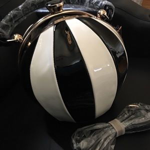 New black and white striped bag with gold handle